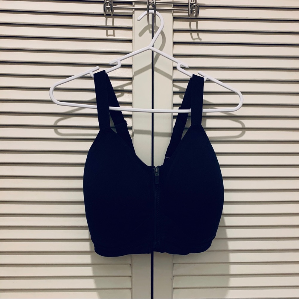 Black zip-front sports bra by Core 10